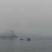 A view of False Klamath Rock in the fog