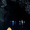 Kayakers in the sea cave entrance at Painted Cave SMCA