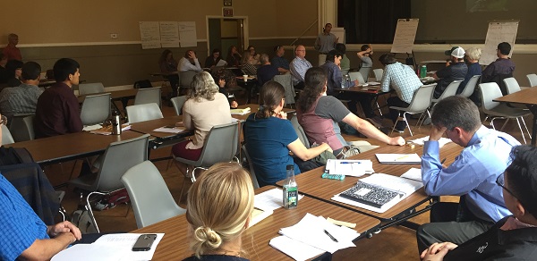 people looking at papers in a meeting