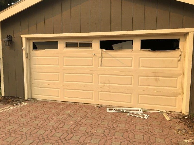 A South Lake Tahoe home shows damage on its garage door where black bears broke in.