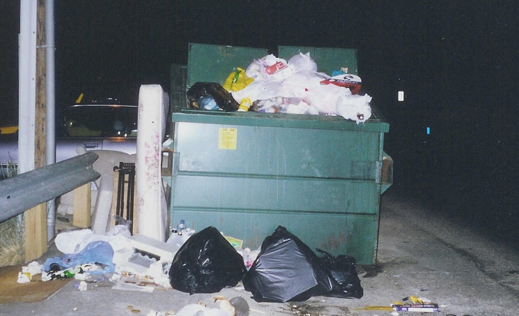 A bear-proof dumpster that's open and overflowing with garbage such as this does little to safeguard black bears from accessing trash.