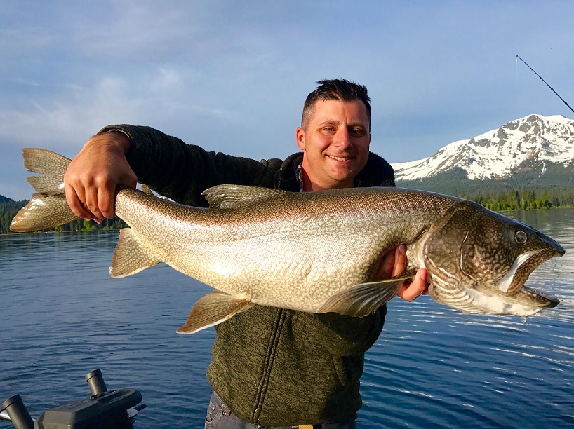 Man holding large fish caught in Tahoe