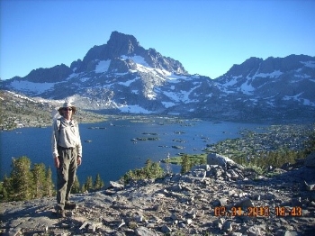 Jim standing in front of an alpine lake