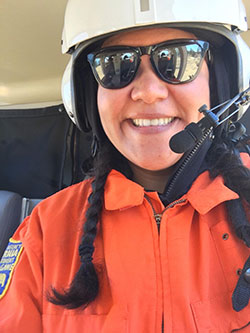 Scientist, Amelia Viera in a helicopter for an aerial deer survey - click to enlarge in new window