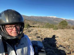 Roberts checking bobcat traps on an ATV in the Inland Deserts Region
