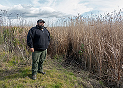 Rocha looking out at wildlife area.