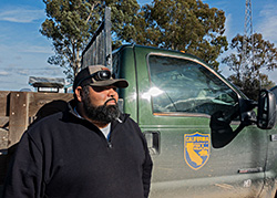 Rocha standing next to California Department of Fish and Wildlife truck.