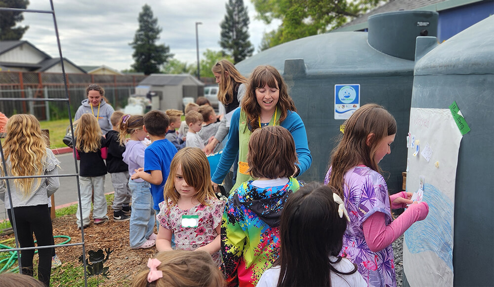 In Santa Rosa, Riebli Elementary students learn about watershed conservation and decorate their rain storage tanks as part of Earth Day activities