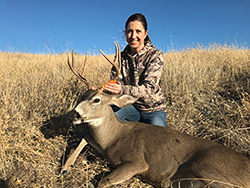 An avid hunter, CDFW Environmental Scientist Shelly Blair shows off the buck she hunted in Zones D3-5 during California’s 2019 deer season.
