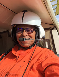 scientist chenelle davis wearing a helmet with a microphone