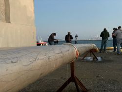Image of pipe used to transport fish from tanker truck. 