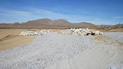Landscape covered in gravel and piles of large rocks
