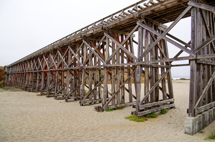 underside of trestle bridge on sandy creek bed