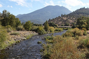 river with mountains in background