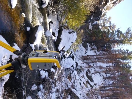 Total Station set up in a snow-covered Silver King Creek