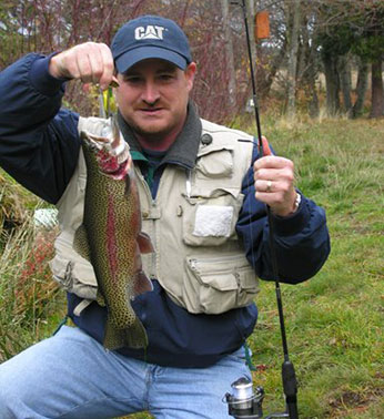 Angler holding the catch of the day - Rainbow Trout