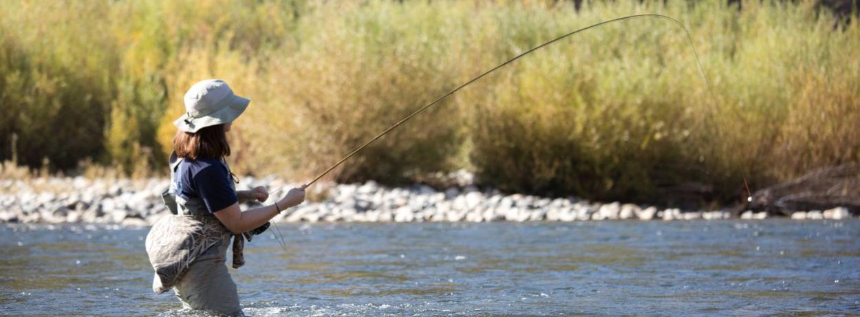 angler fishing in river