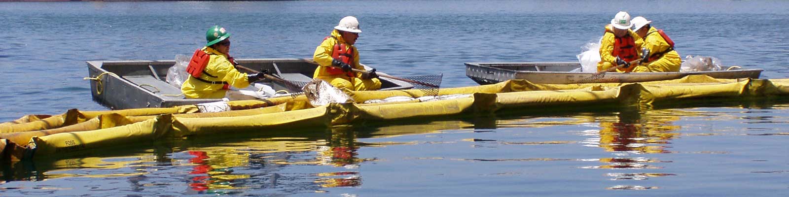 people securing a boom from boats