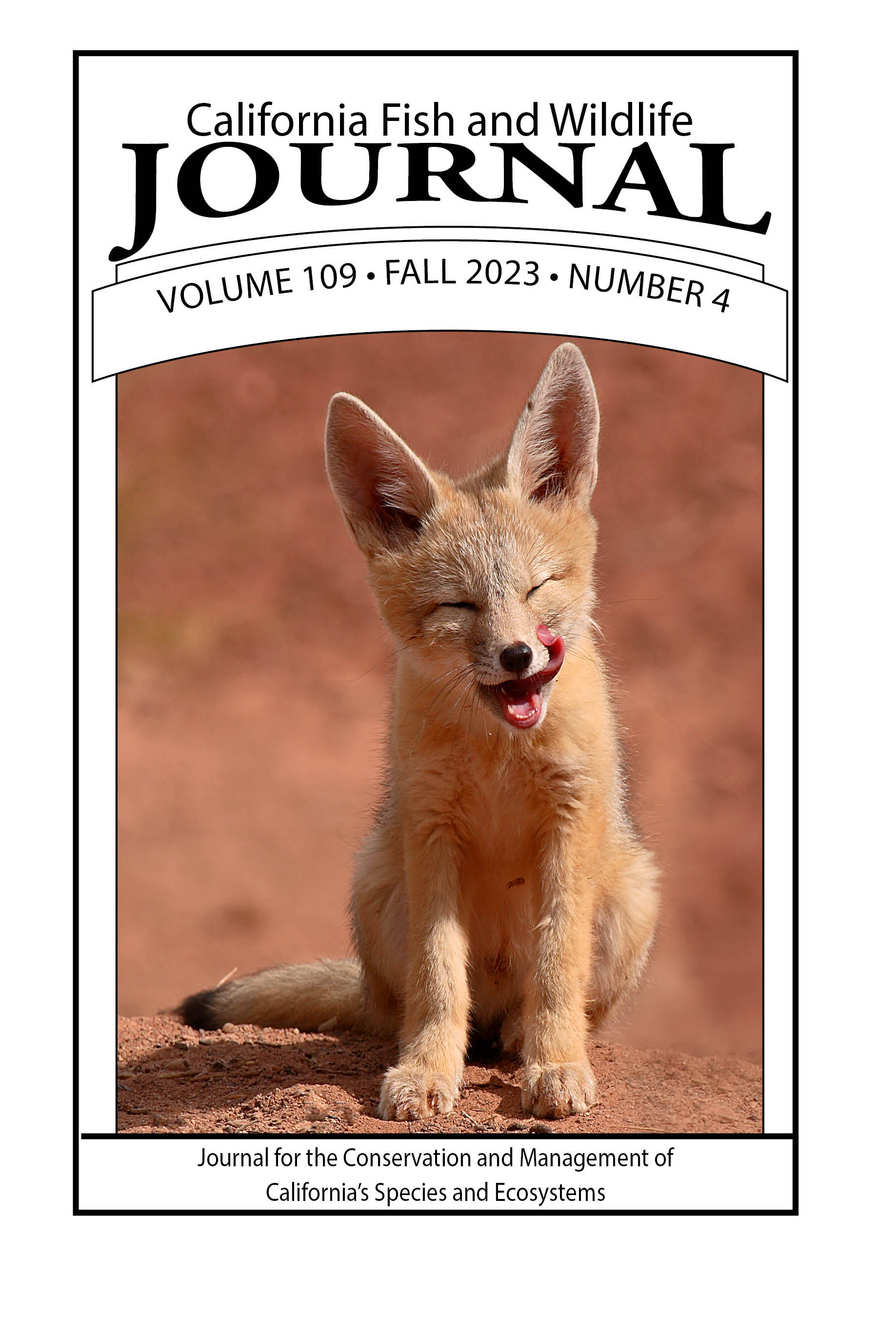 Cover of volume 109 issue 4 with a picture of a kit fox pup in mid-lick