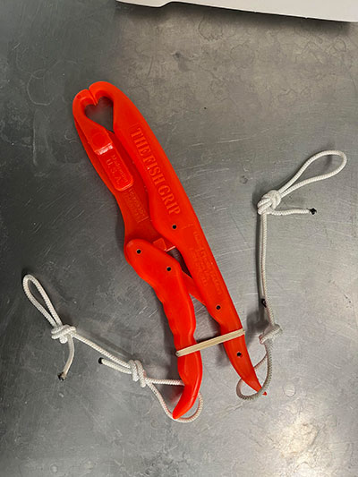 Orange tool resembling pliers