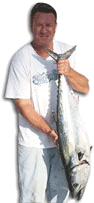Kim Larson displays his state record 21-pound, 5-ounce Pacific bonito